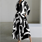Woman wearing a white flower front wrap collared maxi dress - studio photo