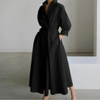 Woman wearing a white letter front wrap collared maxi dress - studio photo