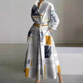 Woman wearing a white front wrap collared maxi dress - lifestyle photo