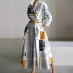 Woman wearing a white front wrap collared maxi dress - lifestyle photo