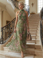 Woman wearing a sage green gathered halter midi dress - editorial style photo