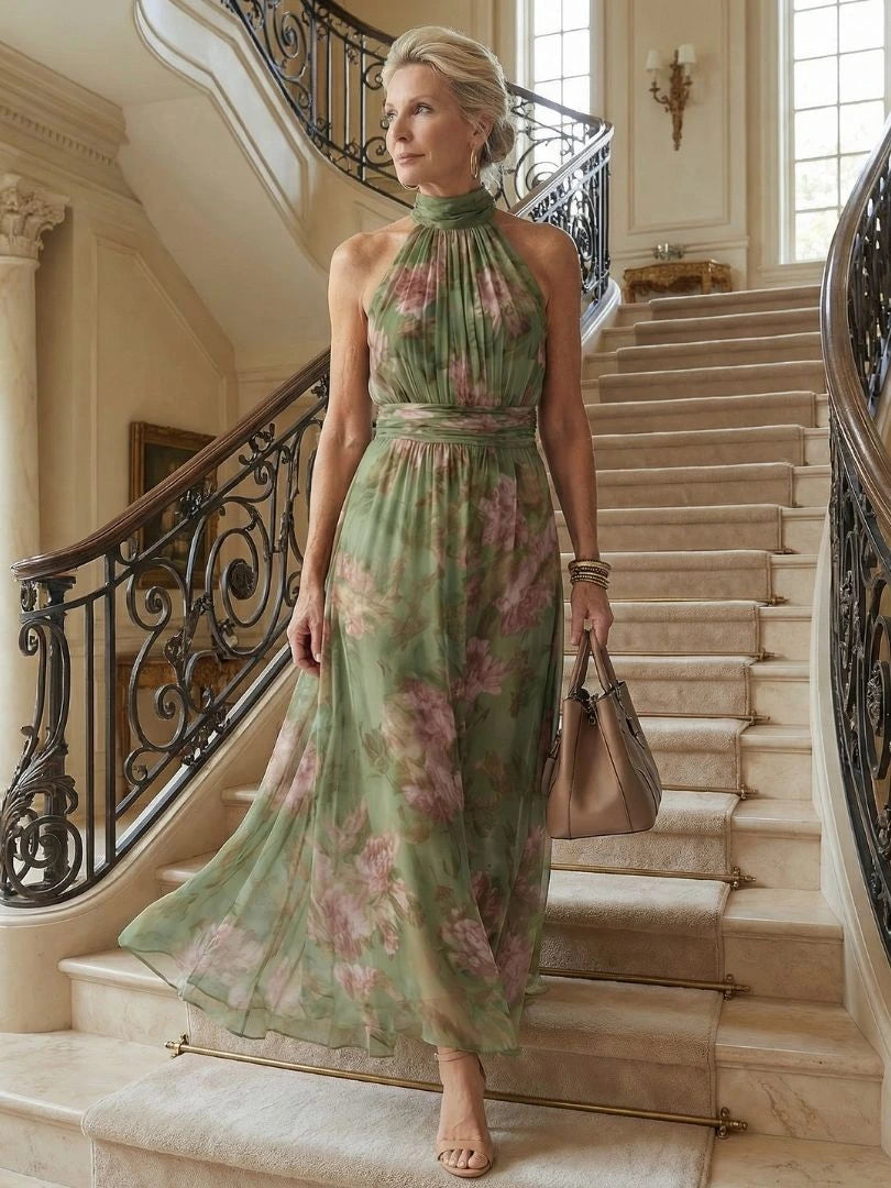 Woman wearing a sage green gathered halter midi dress - editorial style photo