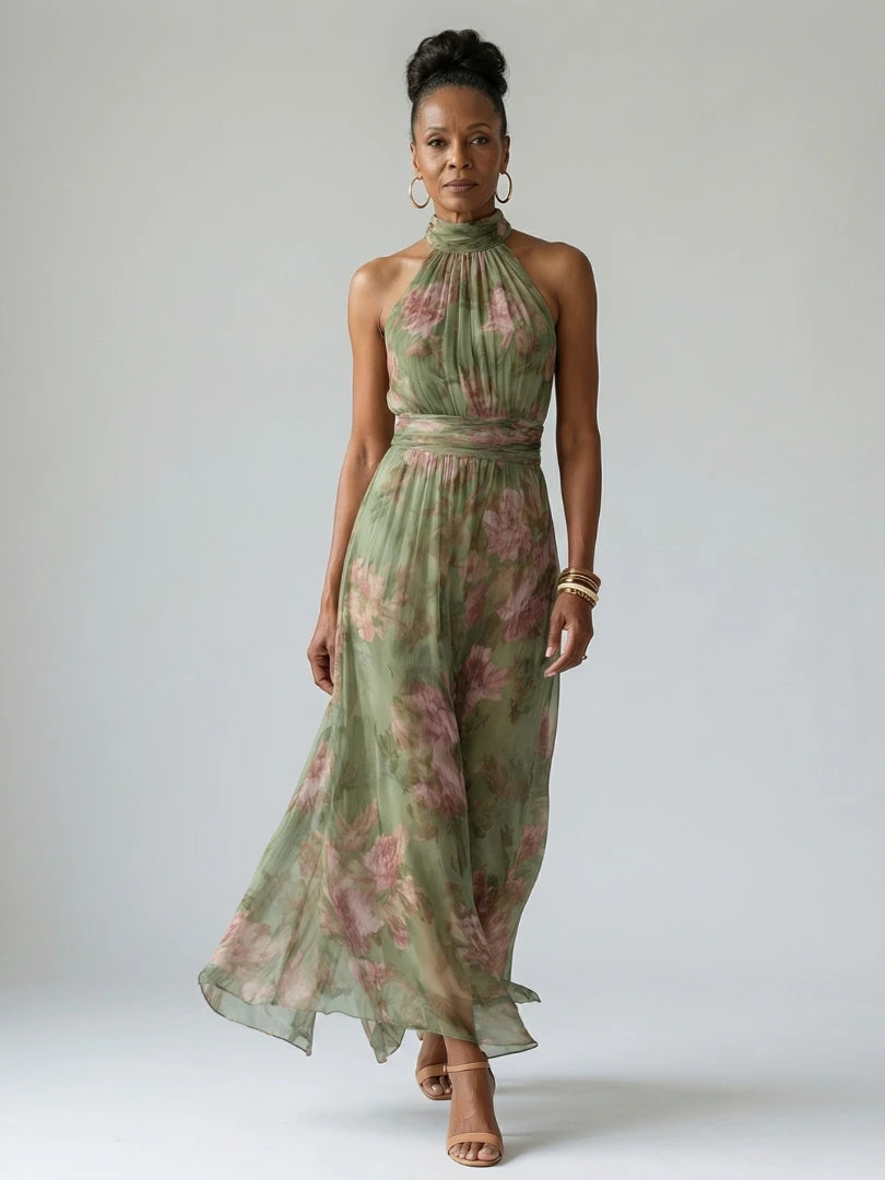Woman wearing a sage green gathered halter midi dress - studio photo
