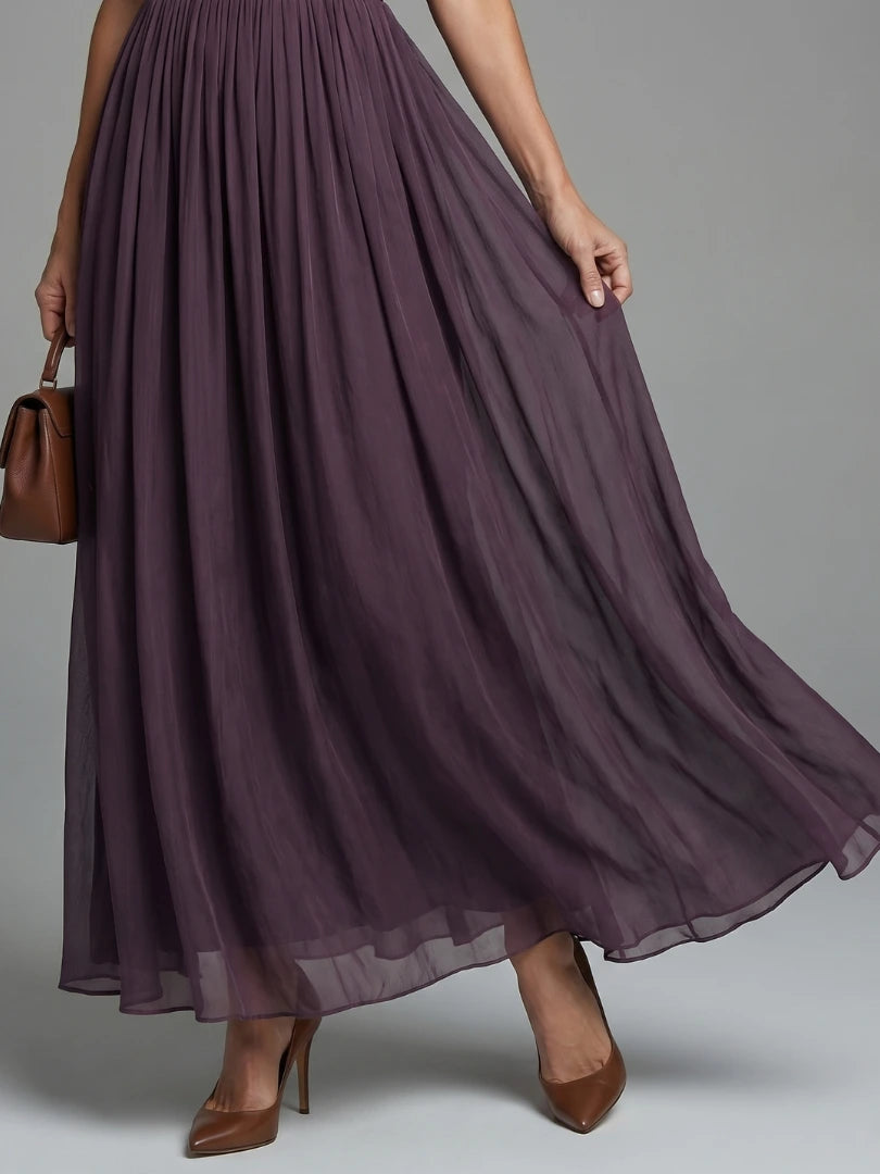 Woman wearing a purple gathered-waist keyhole maxi dress - outdoor lifestyle photo