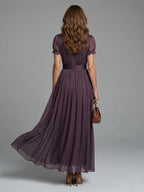 Woman wearing a purple gathered-waist keyhole maxi dress - outdoor lifestyle photo