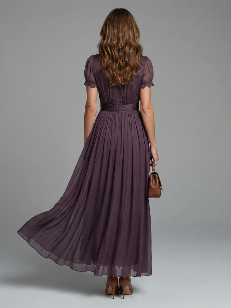 Woman wearing a purple gathered-waist keyhole maxi dress - outdoor lifestyle photo
