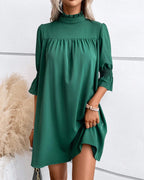 Driftly green high neck mini dress with ruffle sleeves, front view