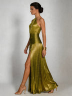 Woman wearing a green halter neck pleated high slit maxi dress - studio photo