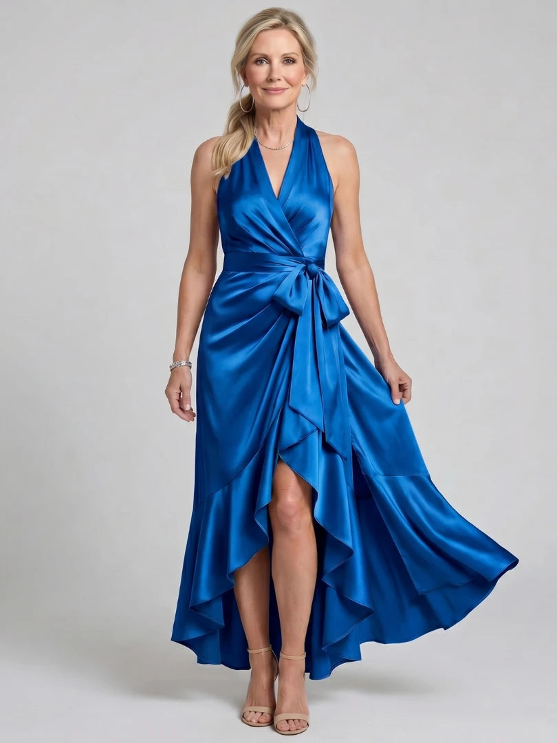 Woman wearing a blue halter wrap asymmetric midi dress - editorial style photo