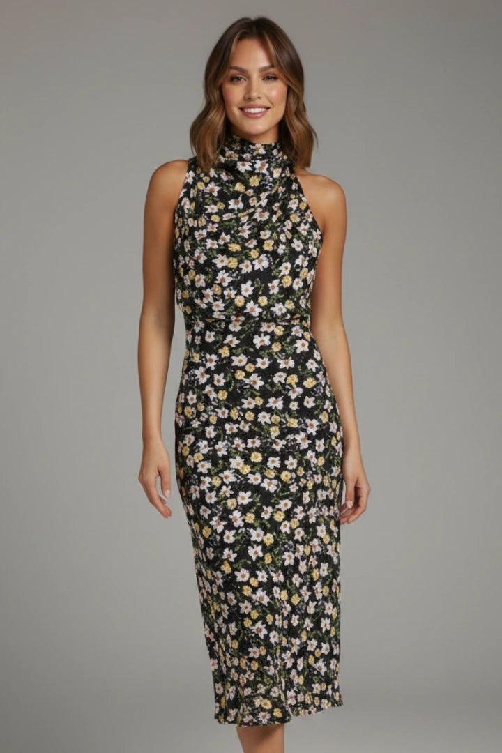 Woman wearing a black floral high neck draped front dress - studio photo