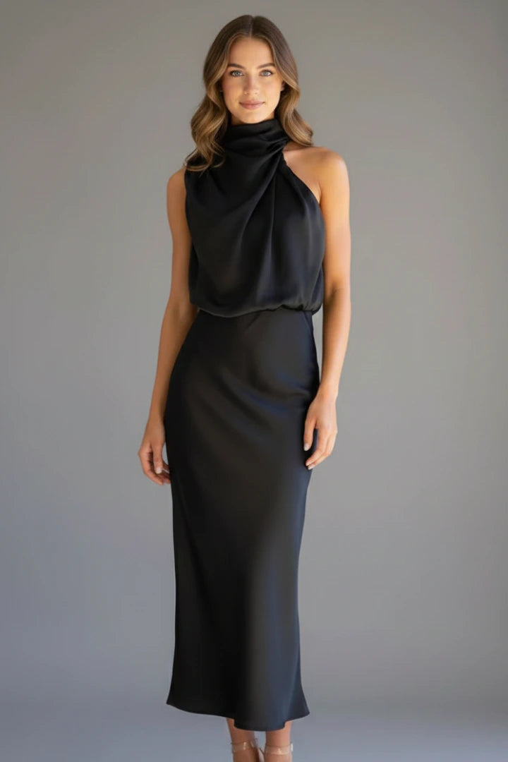 Woman wearing a black high neck draped front dress - studio photo