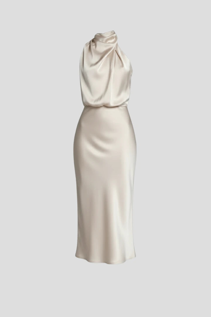 Woman wearing a champagne high neck draped front dress - studio photo