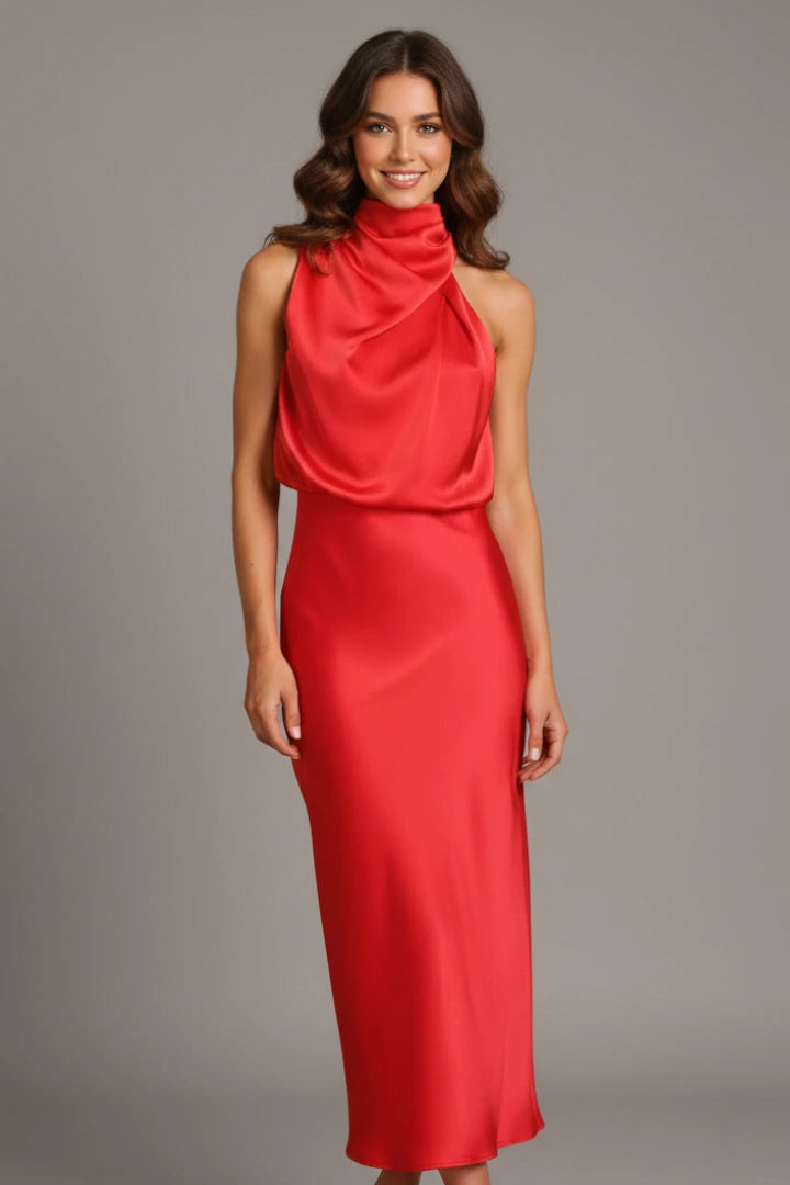 Woman wearing a red high neck draped front dress - studio photo