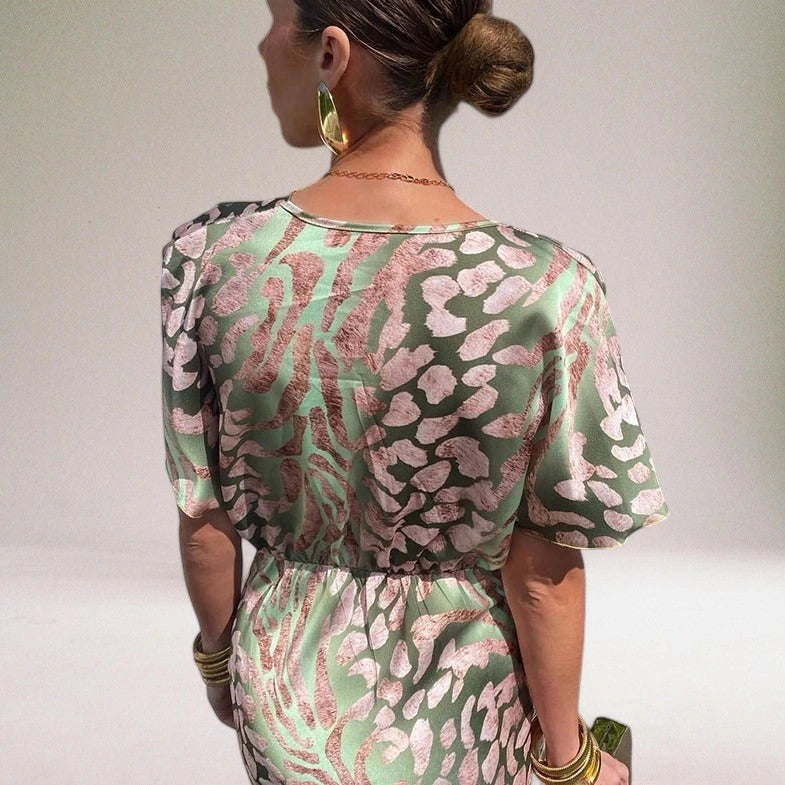 Woman wearing a multicolor knot front midi dress - editorial style photo