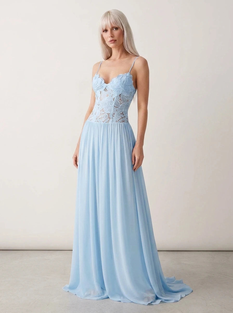Woman wearing a light blue lace bustier maxi dress in a studio setting
