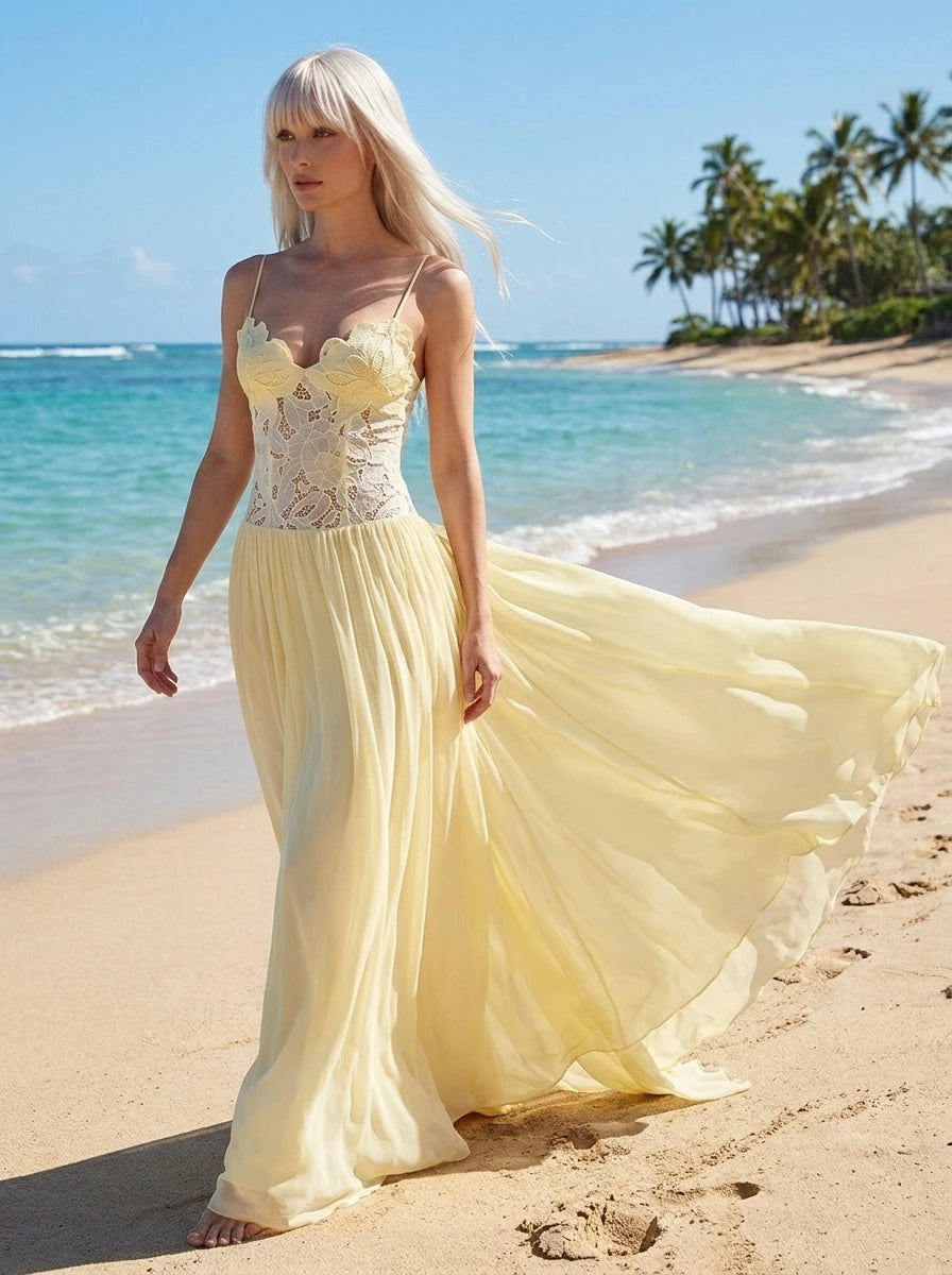 Woman wearing a yellow lace bustier maxi dress on a beach