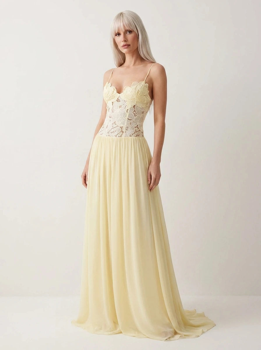 Woman wearing a yellow lace bustier maxi dress in a studio setting