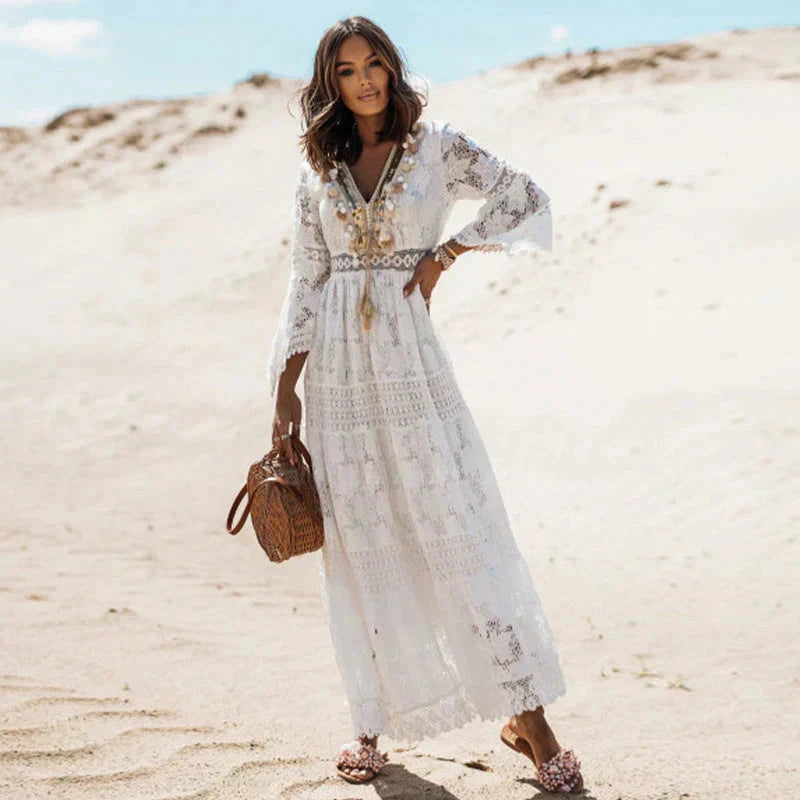 Woman wearing a beige lace long sleeve maxi dress - outdoor desert campaign style photo