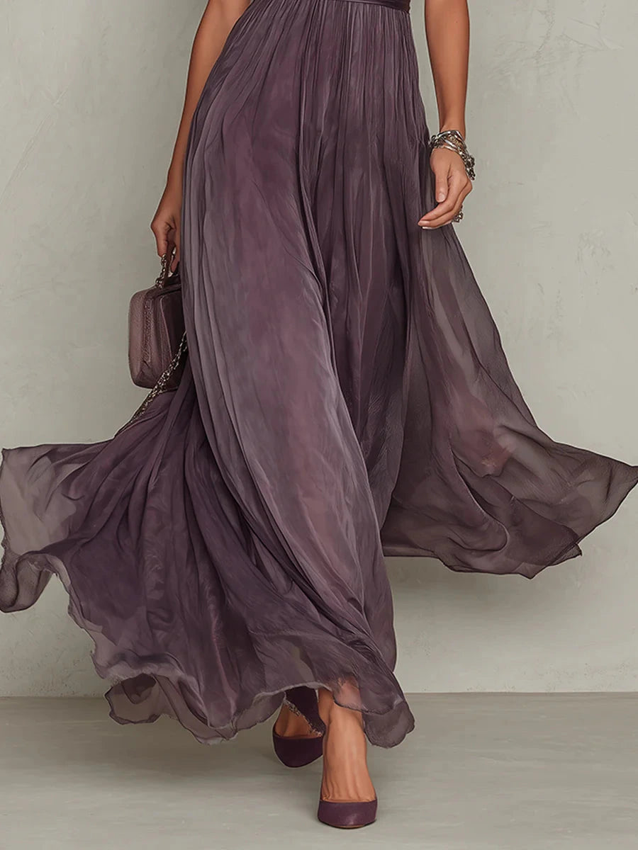 Woman wearing a purple lace trim gathered waist maxi dress - studio photo