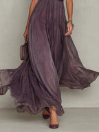 Woman wearing a purple lace trim gathered waist maxi dress - studio photo