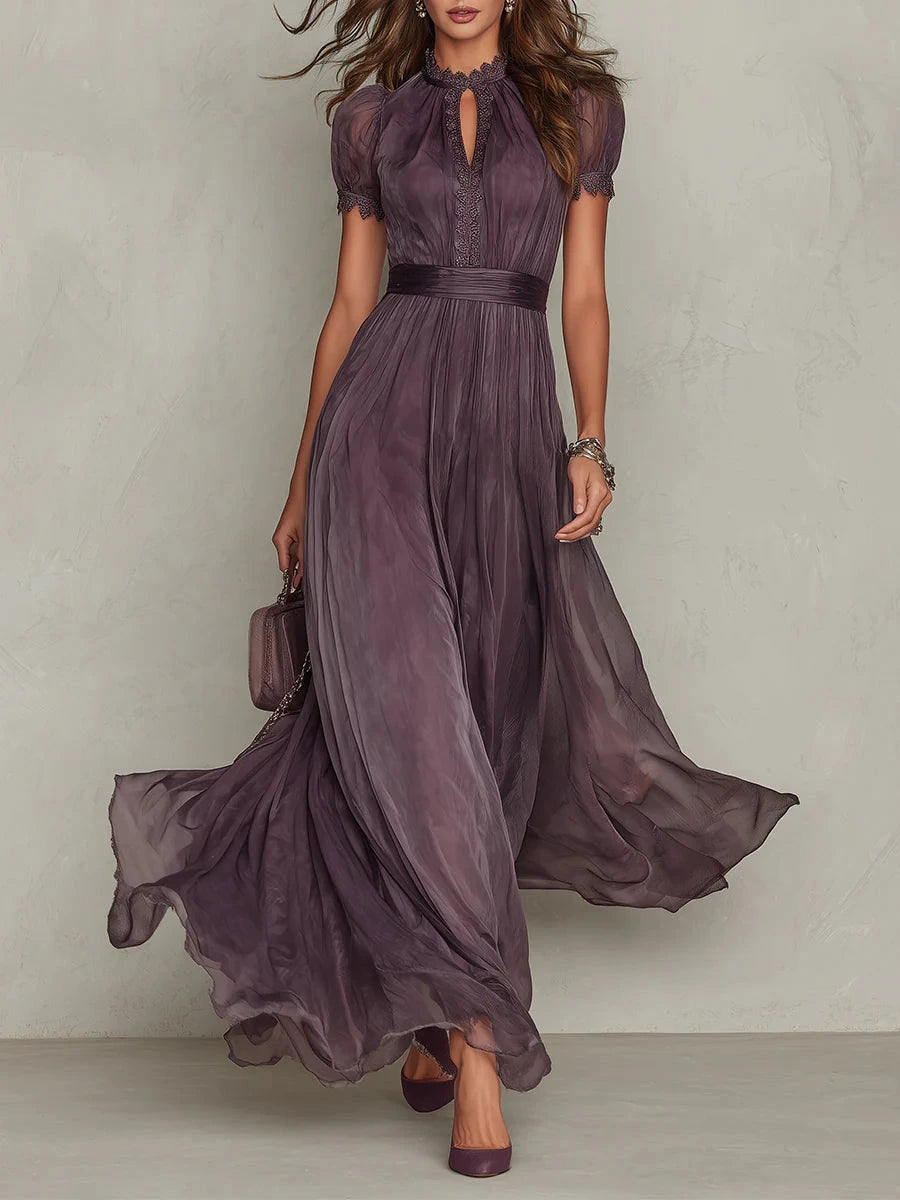 Woman wearing a purple lace trim gathered waist maxi dress - studio photo