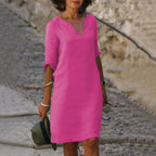 Woman wearing a purple lightweight summer everyday dress - editorial style photo