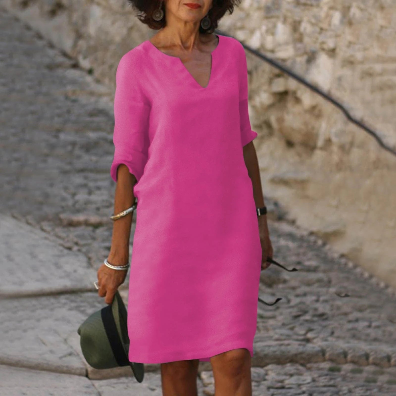 Woman wearing a purple lightweight summer everyday dress - editorial style photo