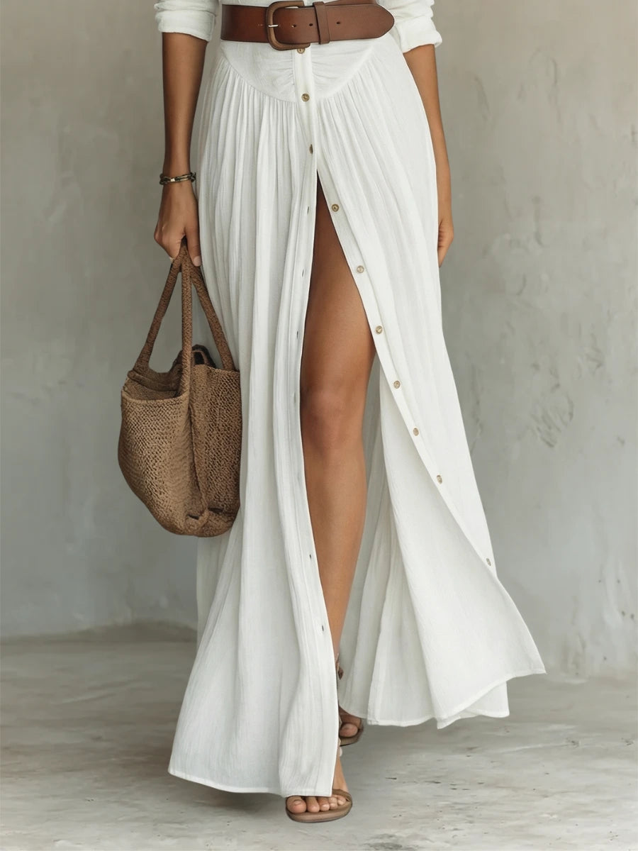Woman wearing a white long sleeve collared dress - lifestyle photo
