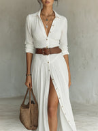 Woman wearing a white long sleeve collared dress - lifestyle photo