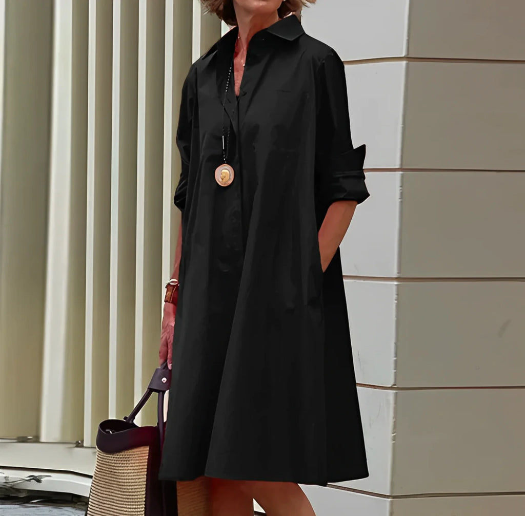 Woman wearing a black long sleeve midi dress - outdoor lifestyle photo