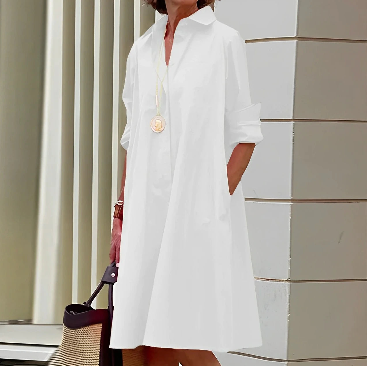 Woman wearing a white long sleeve midi dress - outdoor lifestyle photo