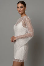 Woman wearing a white mesh overlay sleeveless mini dress - lifestyle photo