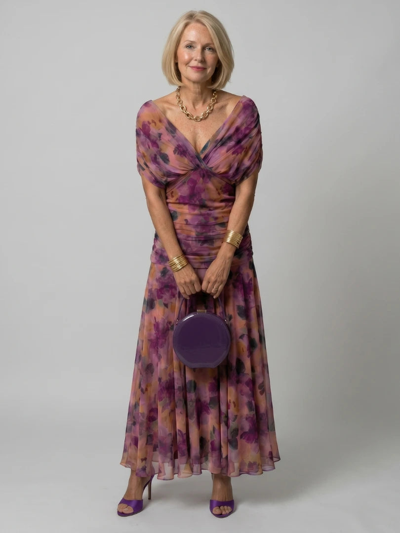 Woman wearing a brown off-shoulder draped midi dress - studio photo