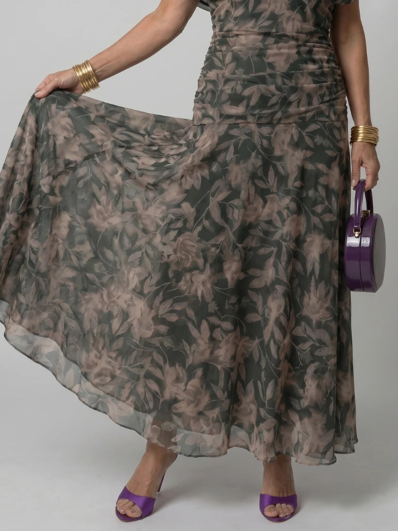 Woman wearing a dark green off-shoulder draped midi dress - editorial style photo
