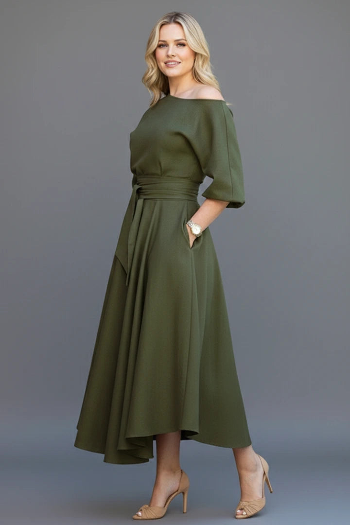 Woman wearing a green off-shoulder lantern sleeve midi dress - lifestyle photo