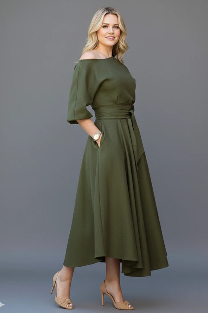 Woman wearing a green off-shoulder lantern sleeve midi dress - lifestyle photo