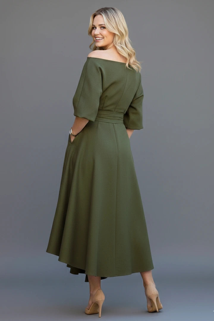 Woman wearing a green off-shoulder lantern sleeve midi dress - lifestyle photo