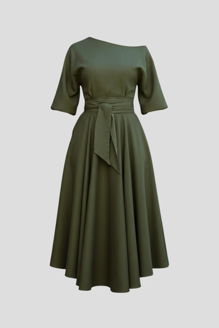 Woman wearing a green off-shoulder lantern sleeve midi dress - studio photo
