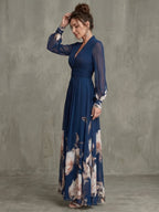 Woman wearing a navy pleated sheer sleeves maxi dress - studio photo