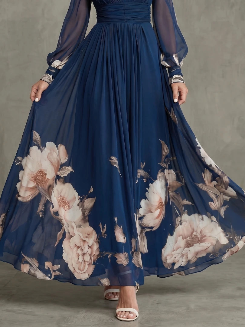 Woman wearing a navy pleated sheer sleeves maxi dress - studio photo