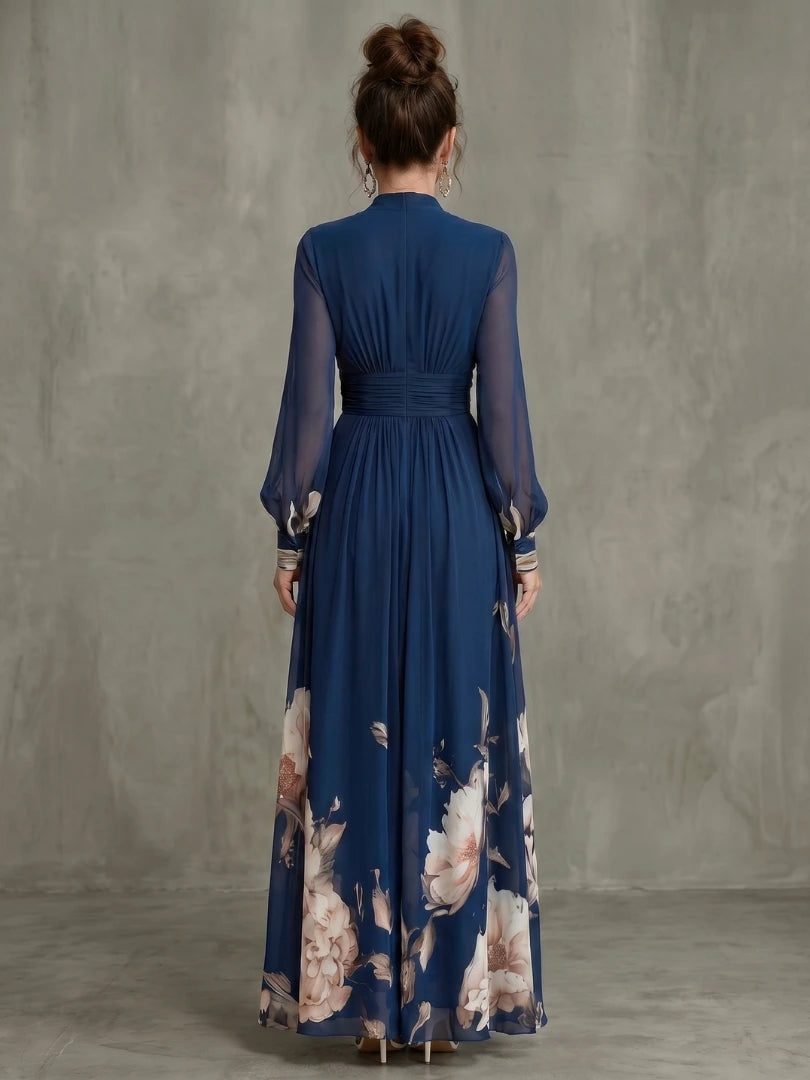 Woman wearing a navy pleated sheer sleeves maxi dress - studio photo