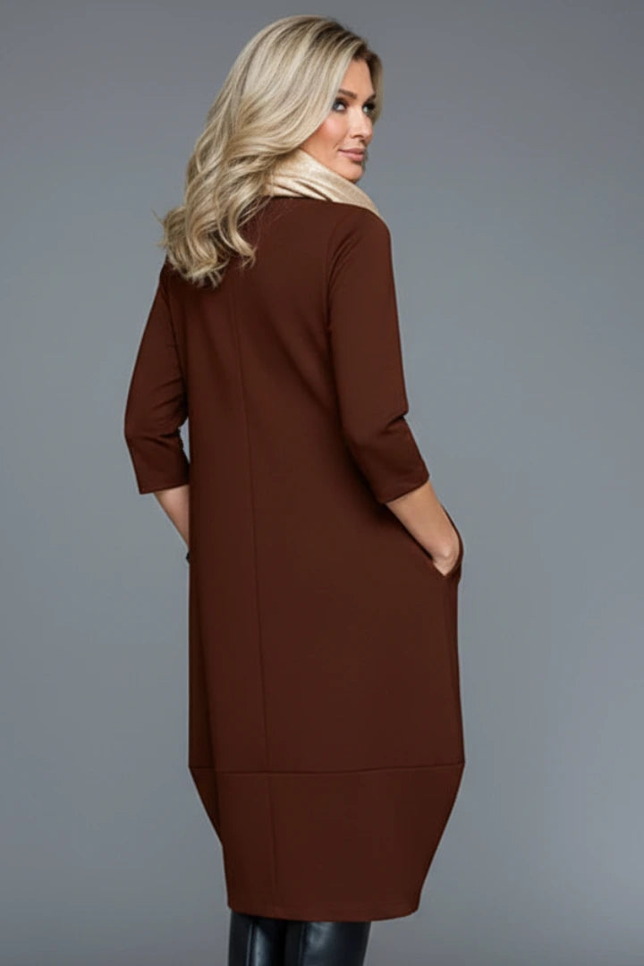 Woman wearing a brown round neck pocket midi dress - studio photo