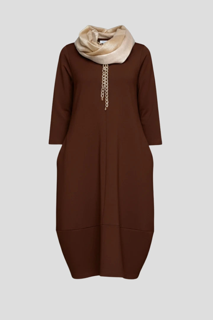 Woman wearing a brown round neck pocket midi dress - studio photo
