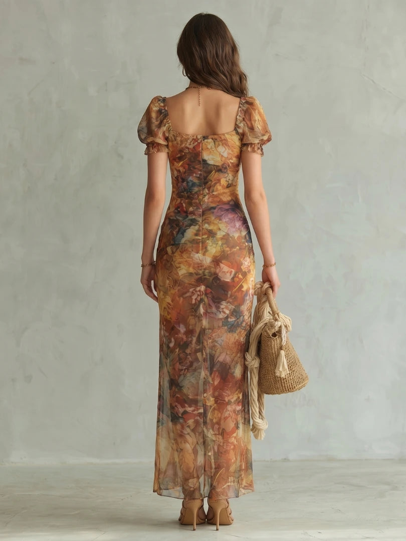 Woman wearing a multicolour ruffled sleeve ruched slit midi dress - studio photo