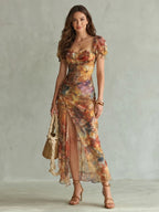 Woman wearing a multicolour ruffled sleeve ruched slit midi dress - studio photo