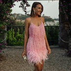 Woman wearing a dark pink sequin spaghetti strap fitted dress - editorial style photo
