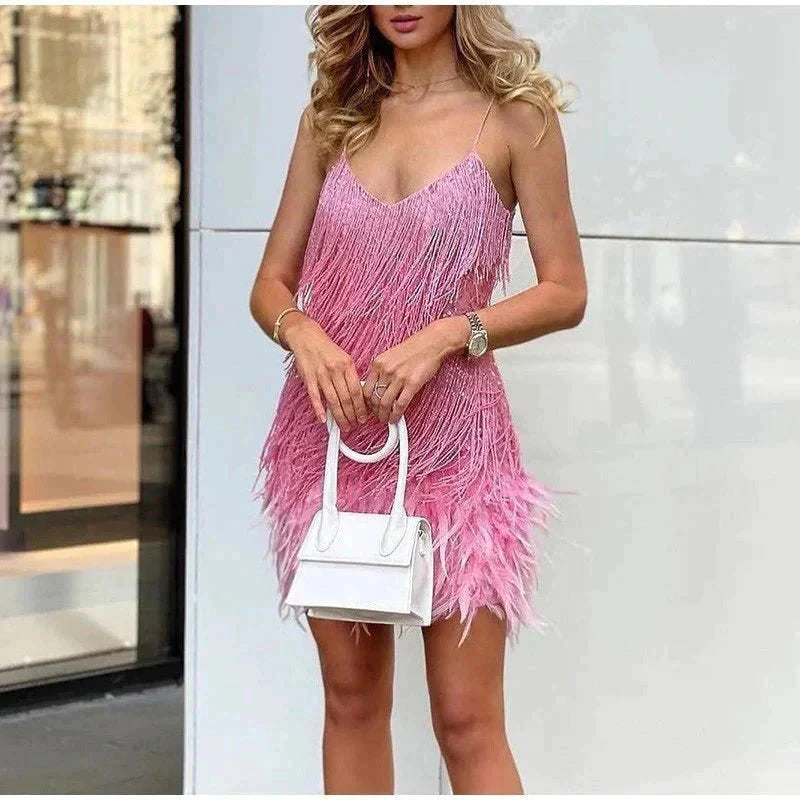 Woman wearing a dark pink sequin spaghetti strap fitted dress - editorial style photo