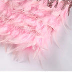 Woman wearing a dark pink sequin spaghetti strap fitted dress - studio photo