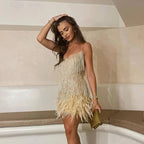 Woman wearing a gold sequin spaghetti strap fitted dress - editorial style photo