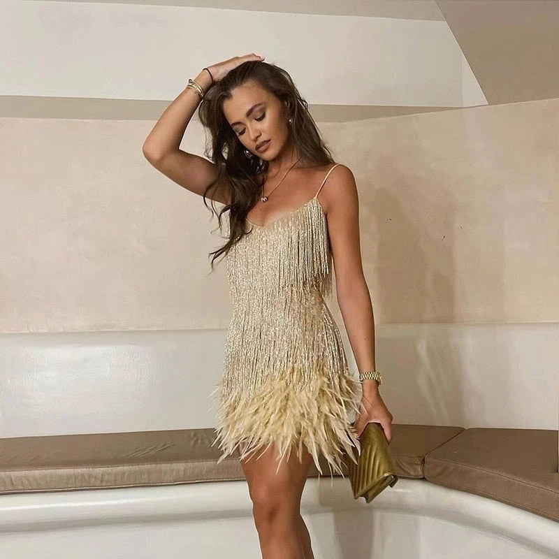 Woman wearing a gold sequin spaghetti strap fitted dress - editorial style photo